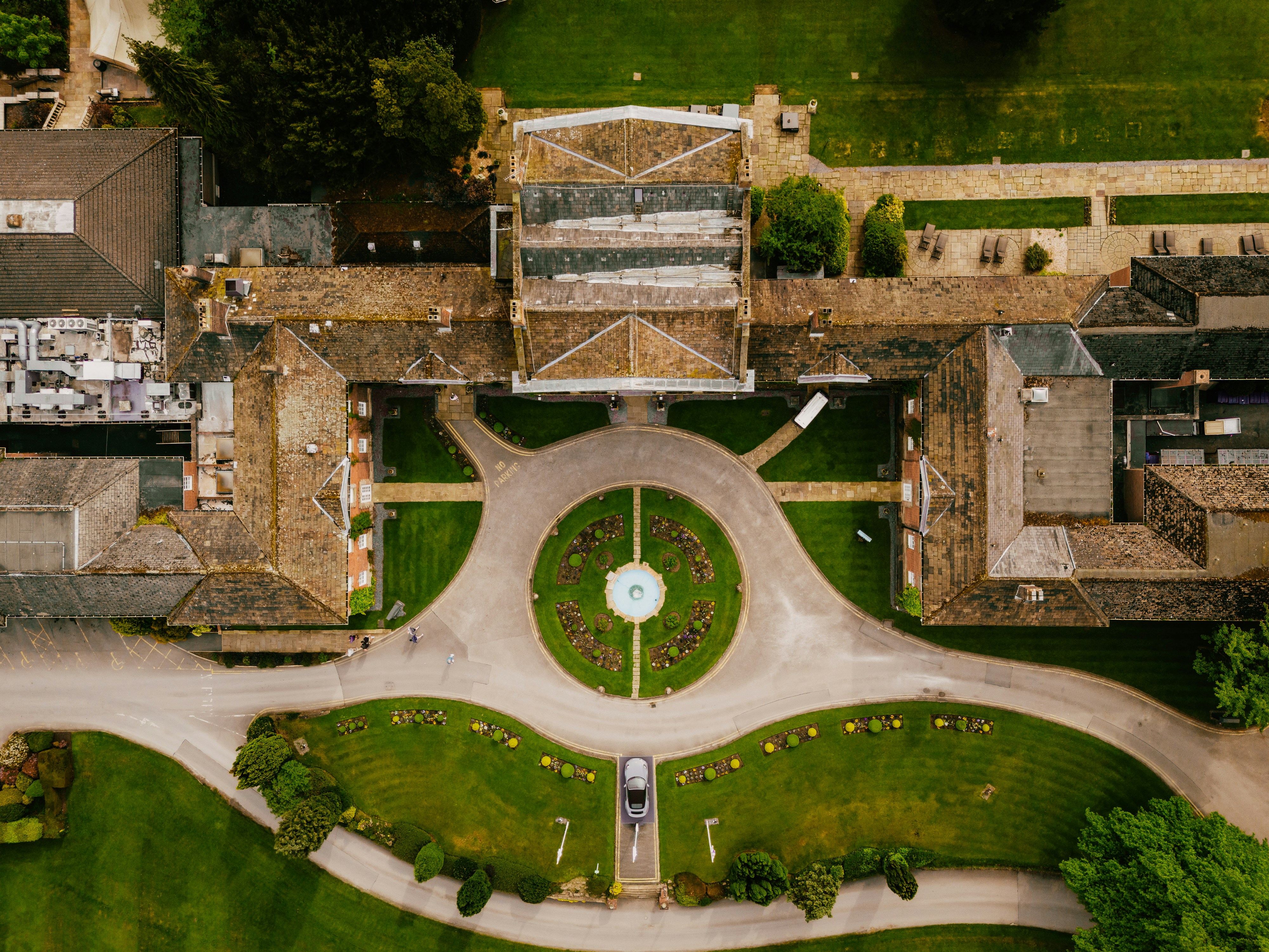 An aerial view of a large building with a clock tower
