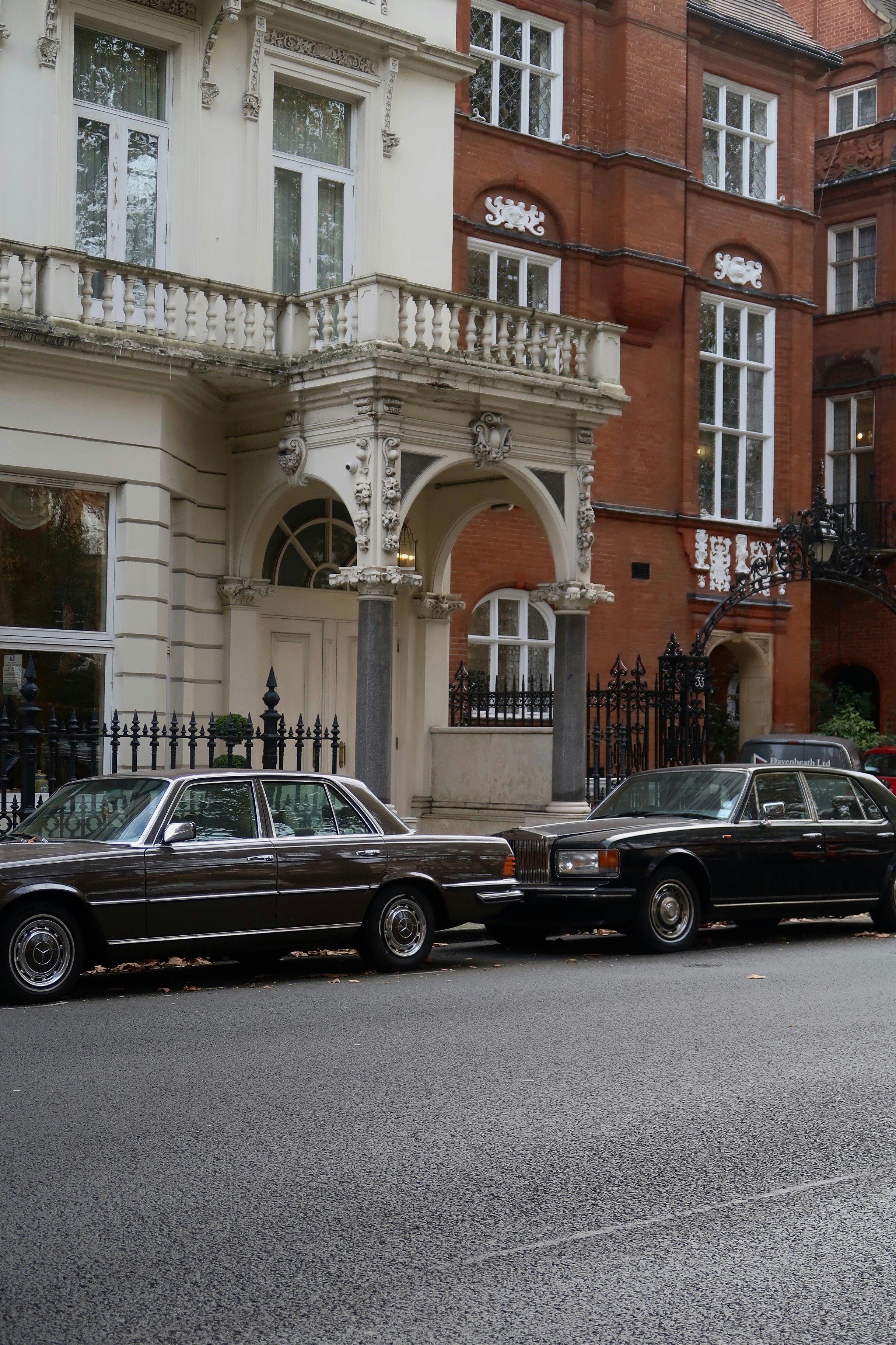 A row of parked cars on a city street
