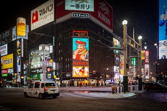 A city street filled with lots of tall buildings