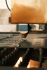 A close up of a machine cutting a piece of metal