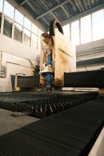 A machine that is cutting a piece of metal