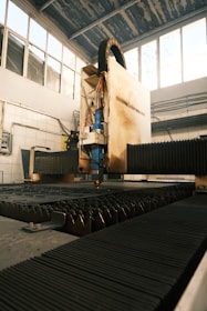 A machine that is cutting a piece of metal