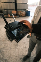 A man holding a tablet in his hand