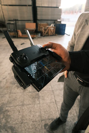 A man holding a tablet in his hand
