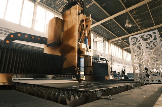 A large machine is in a large building