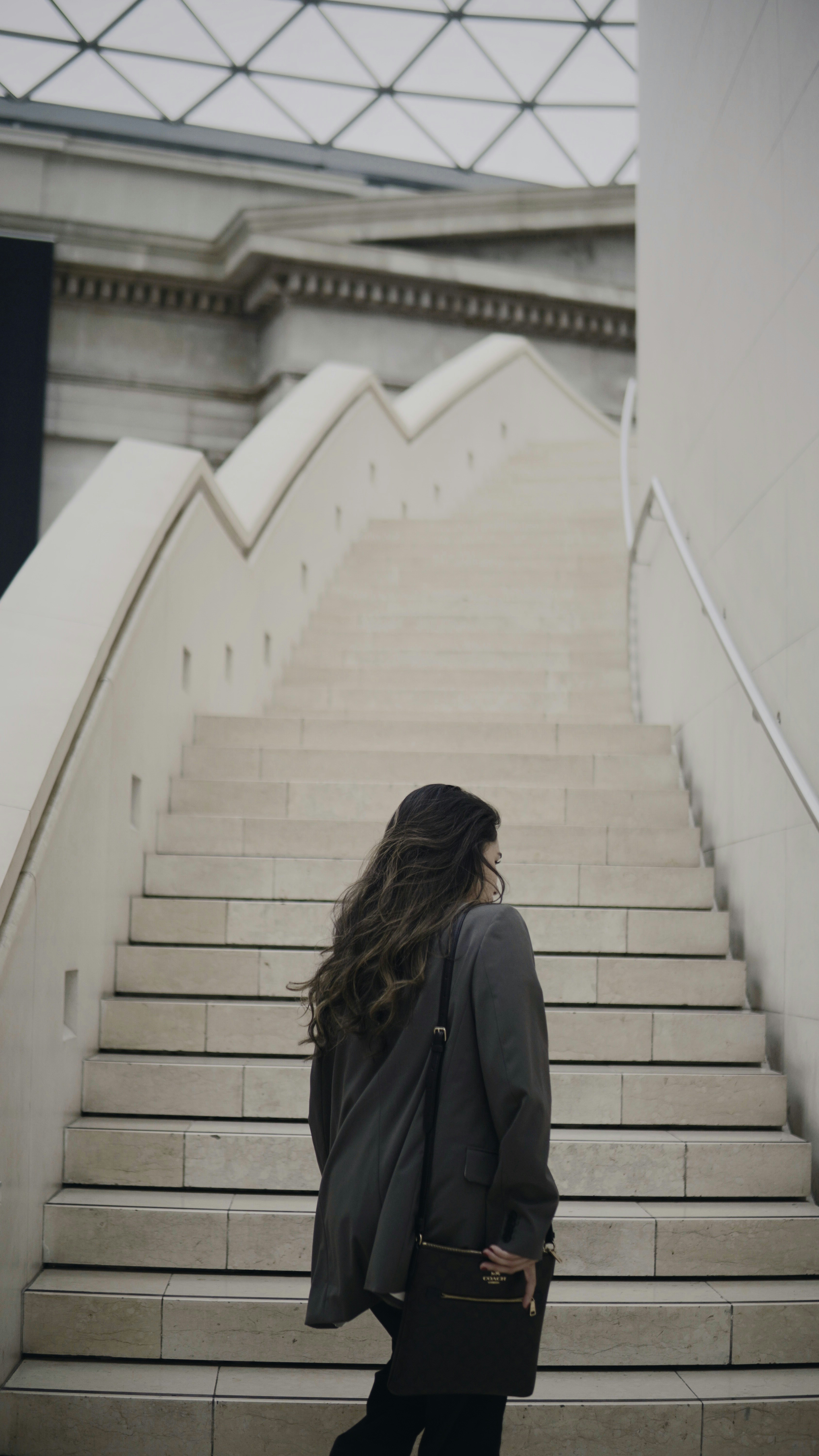 A woman walking down a flight of stairs