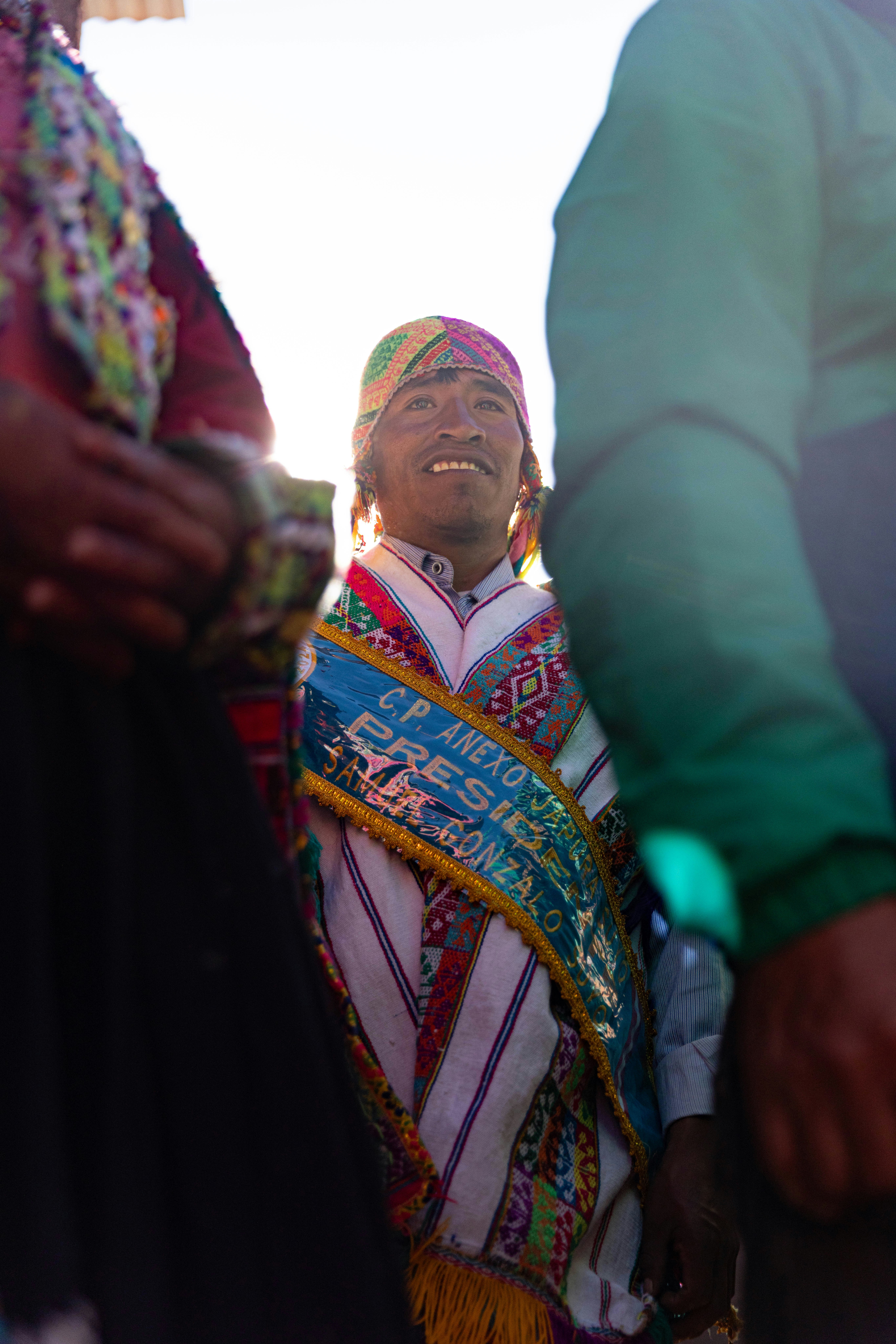 A group of people standing around each other
