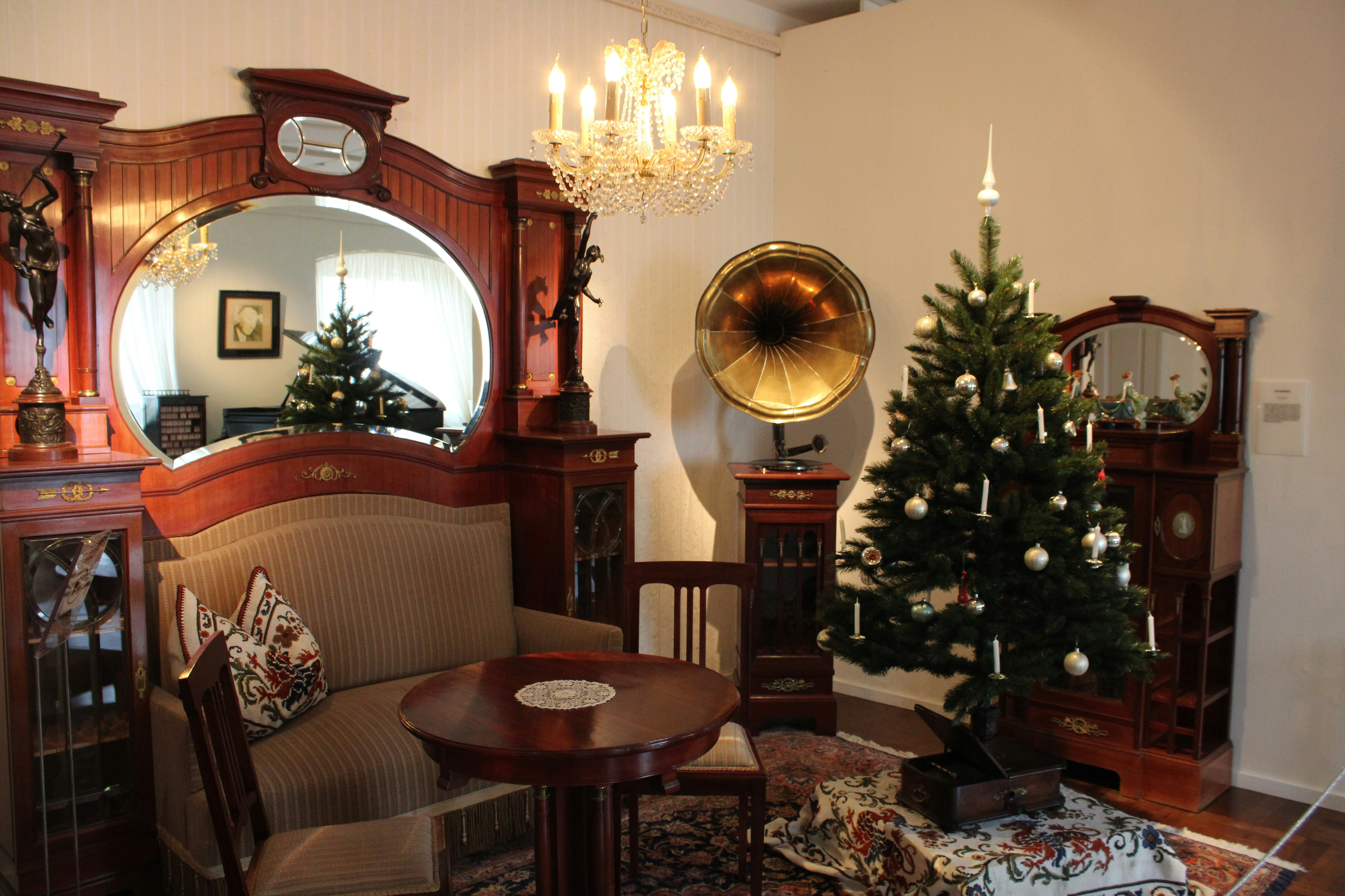 A living room filled with furniture and a christmas tree
