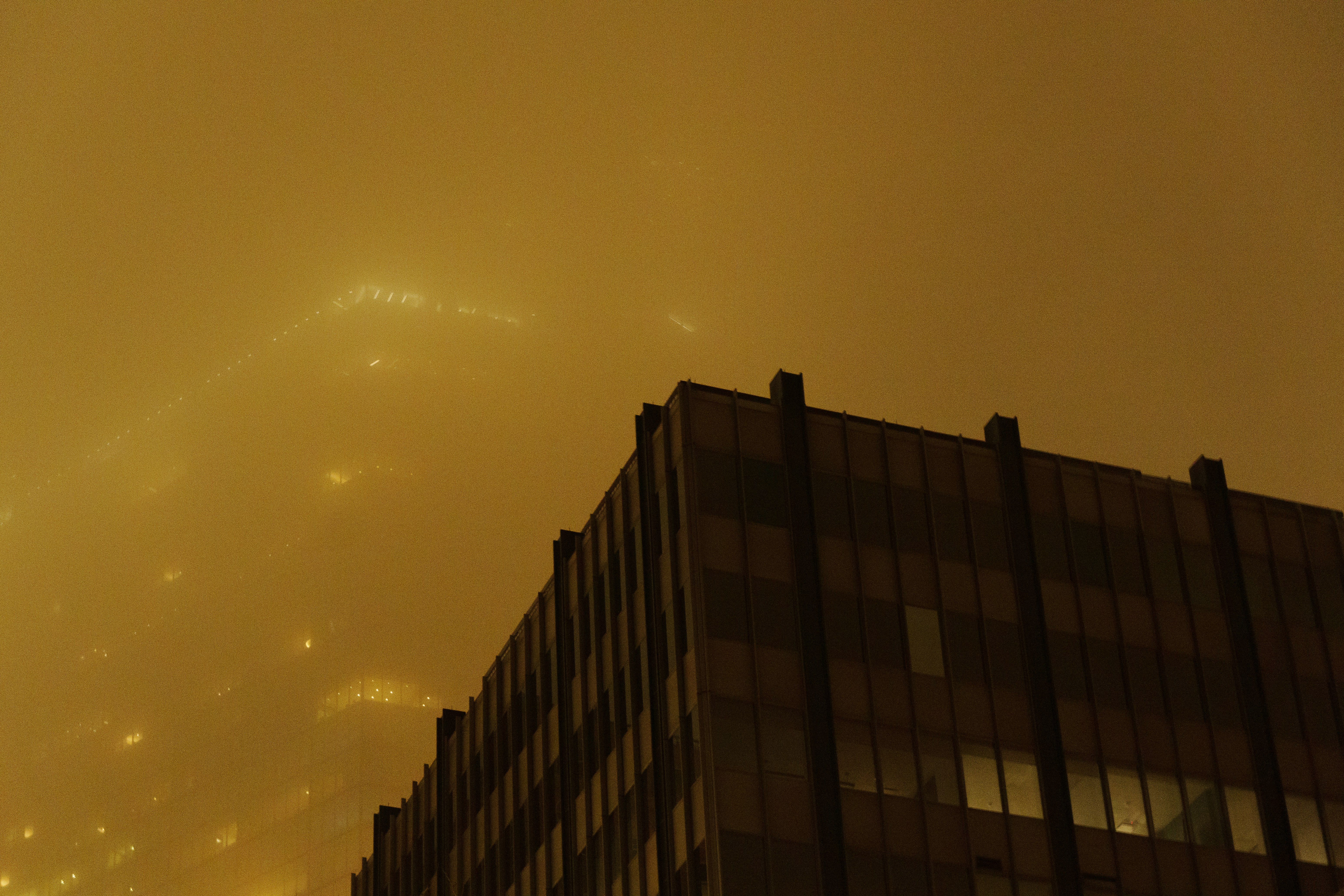 A very tall building with a sky in the background