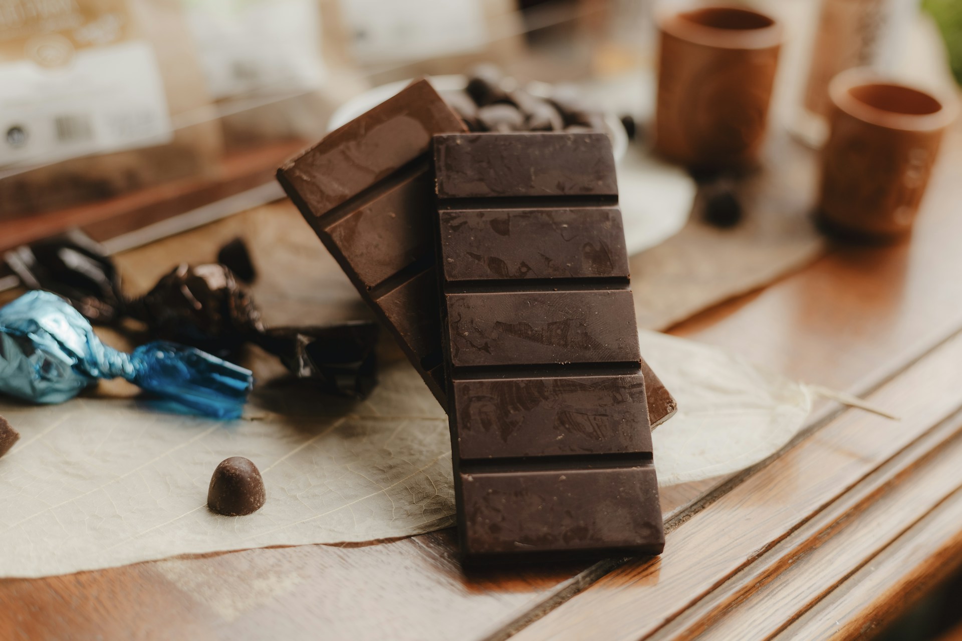 A pile of chocolate sitting on top of a wooden table