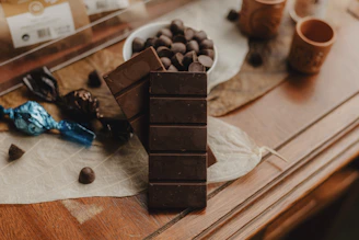 A table topped with a bowl of chocolate