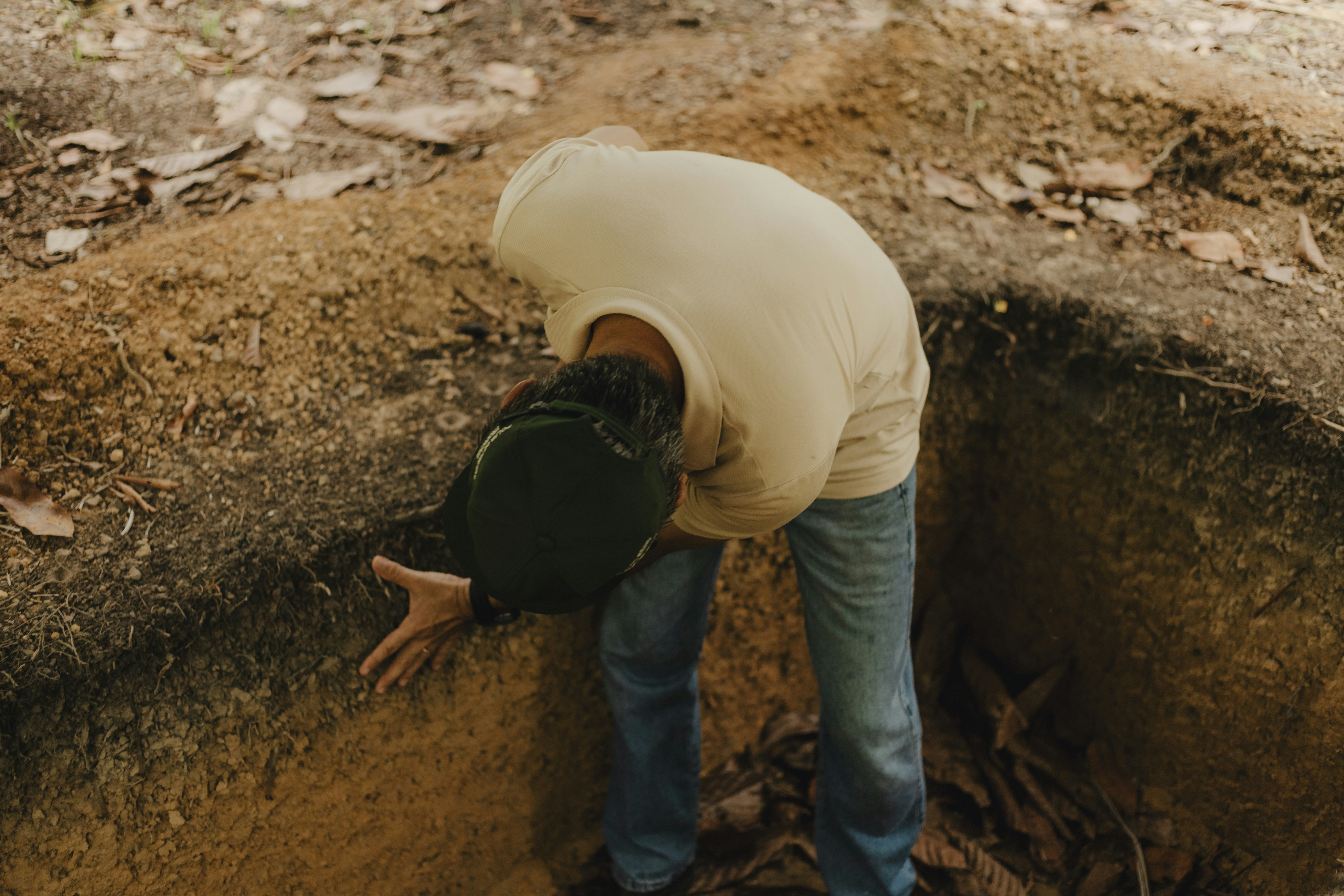 person digging trench - home made french drain