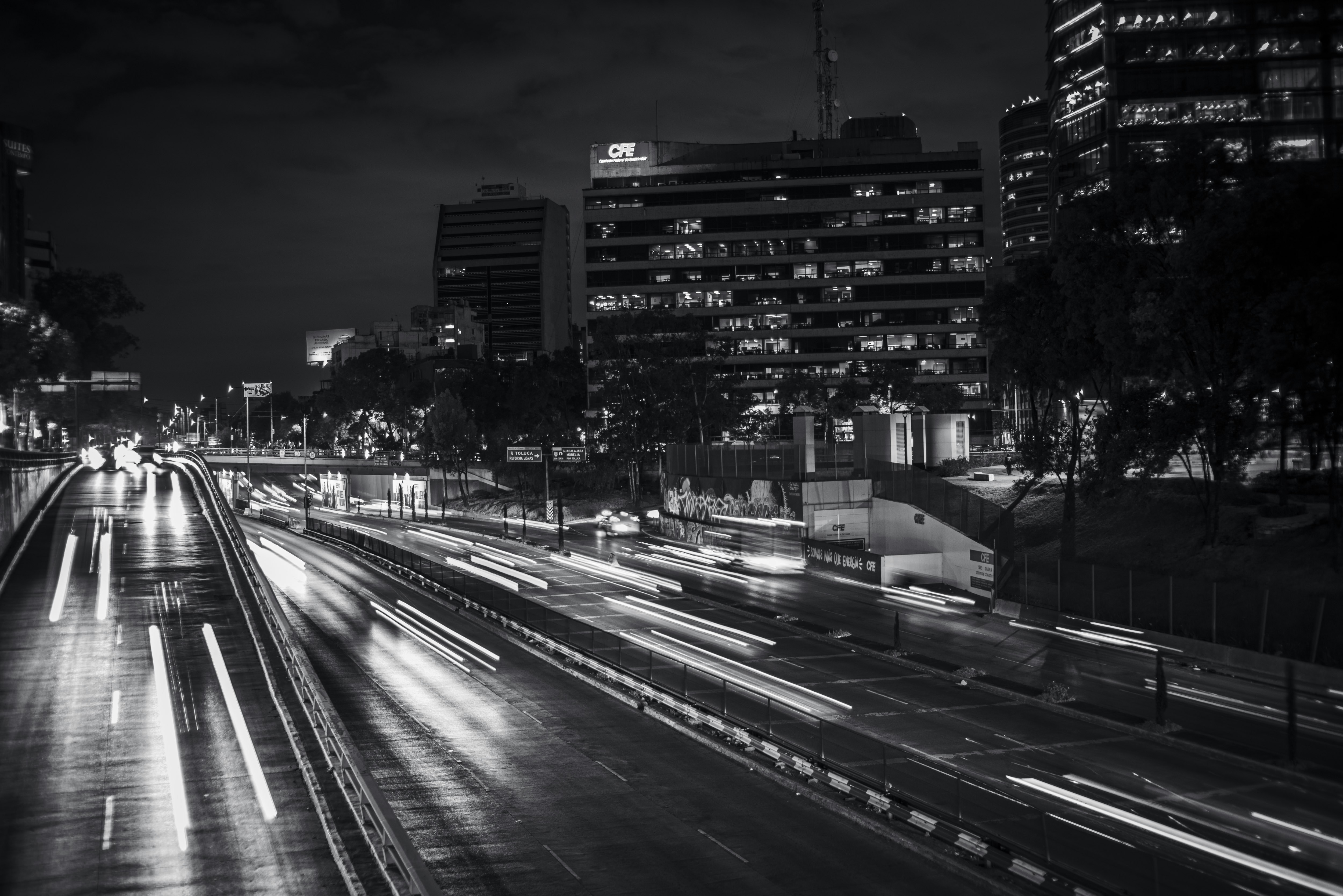 A black and white photo of a city at night