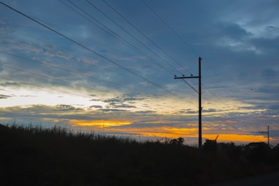 The sun is setting over a rural area