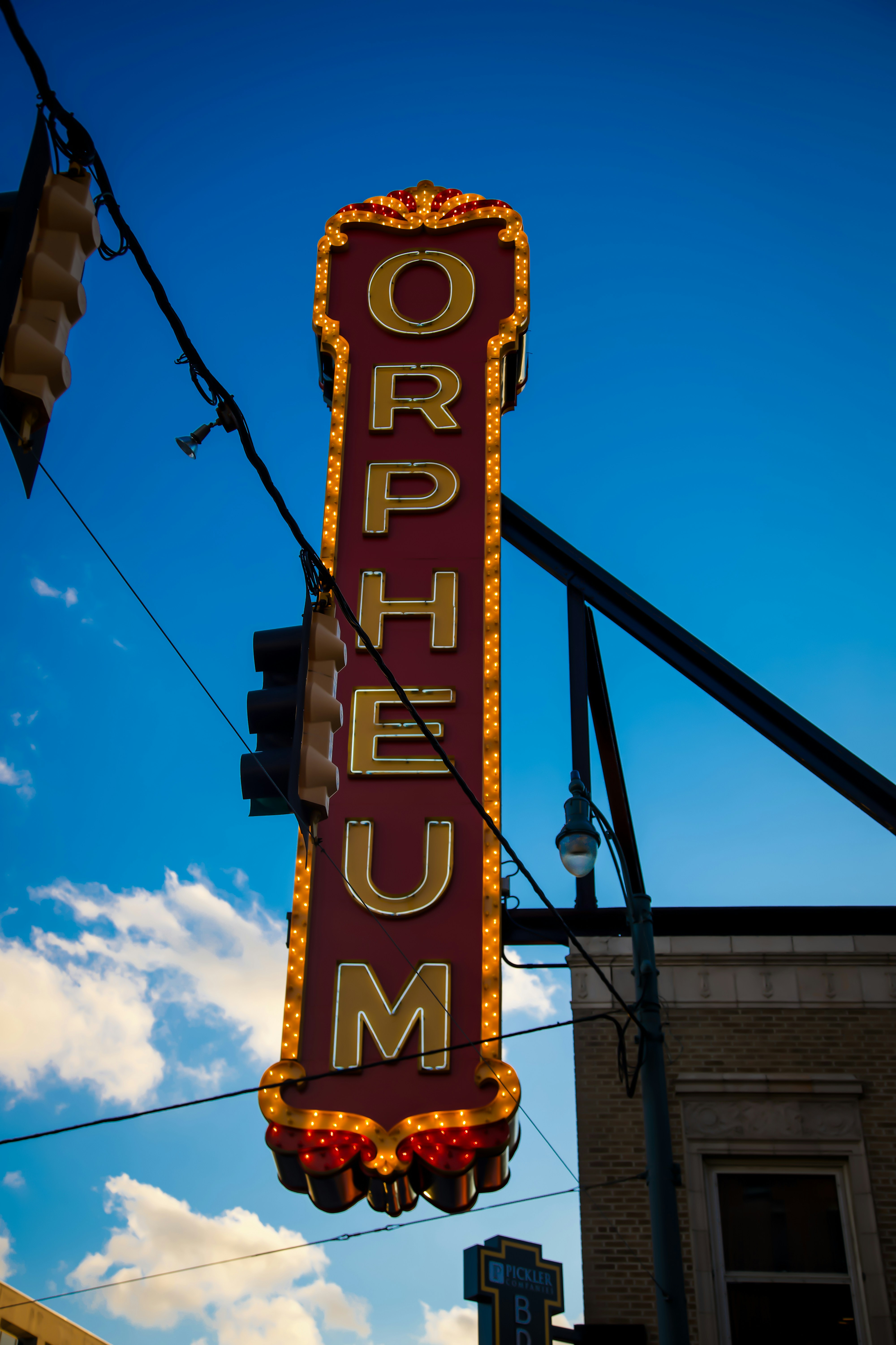A large sign hanging from the side of a building