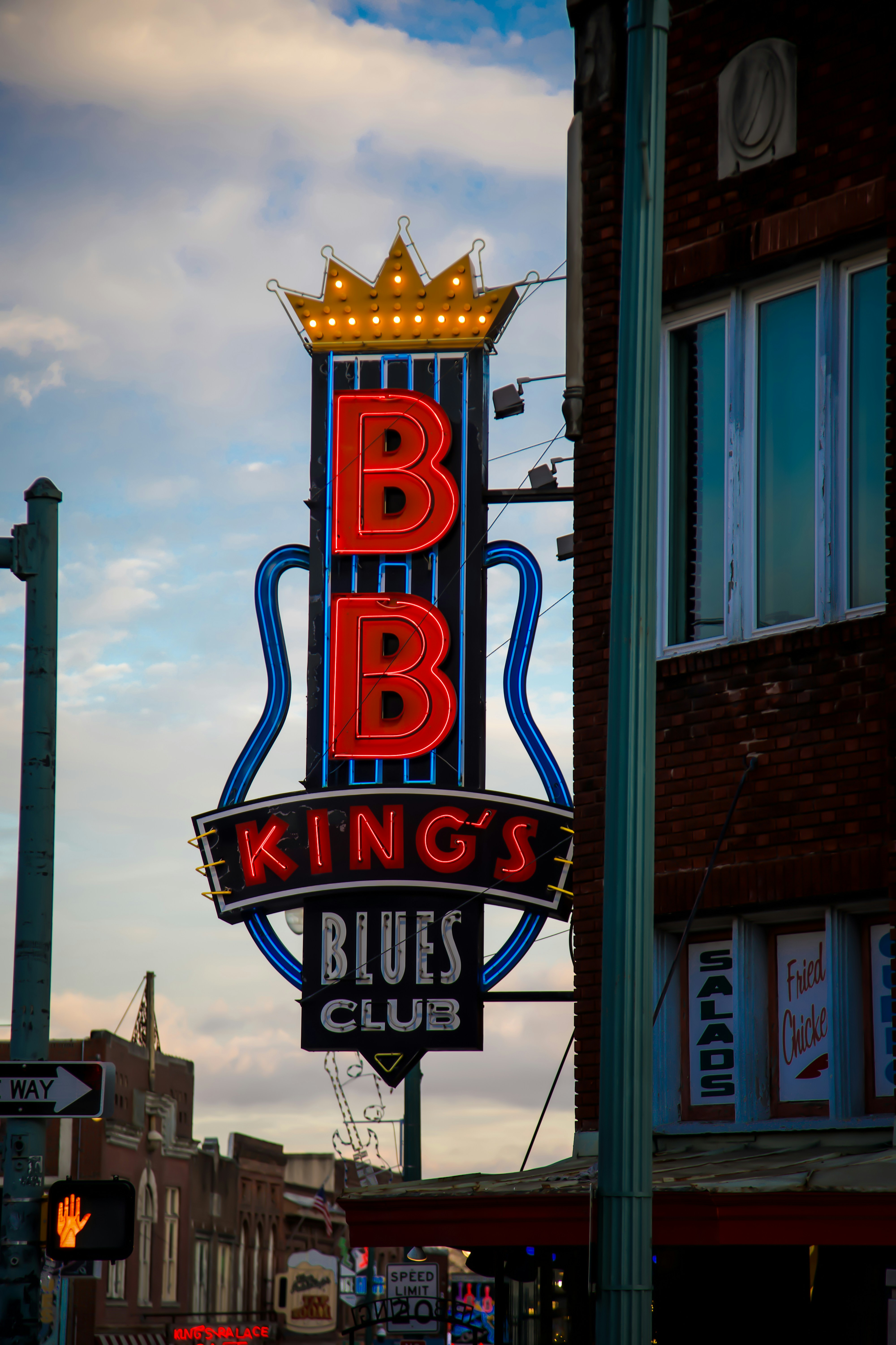 A large neon sign on the side of a building