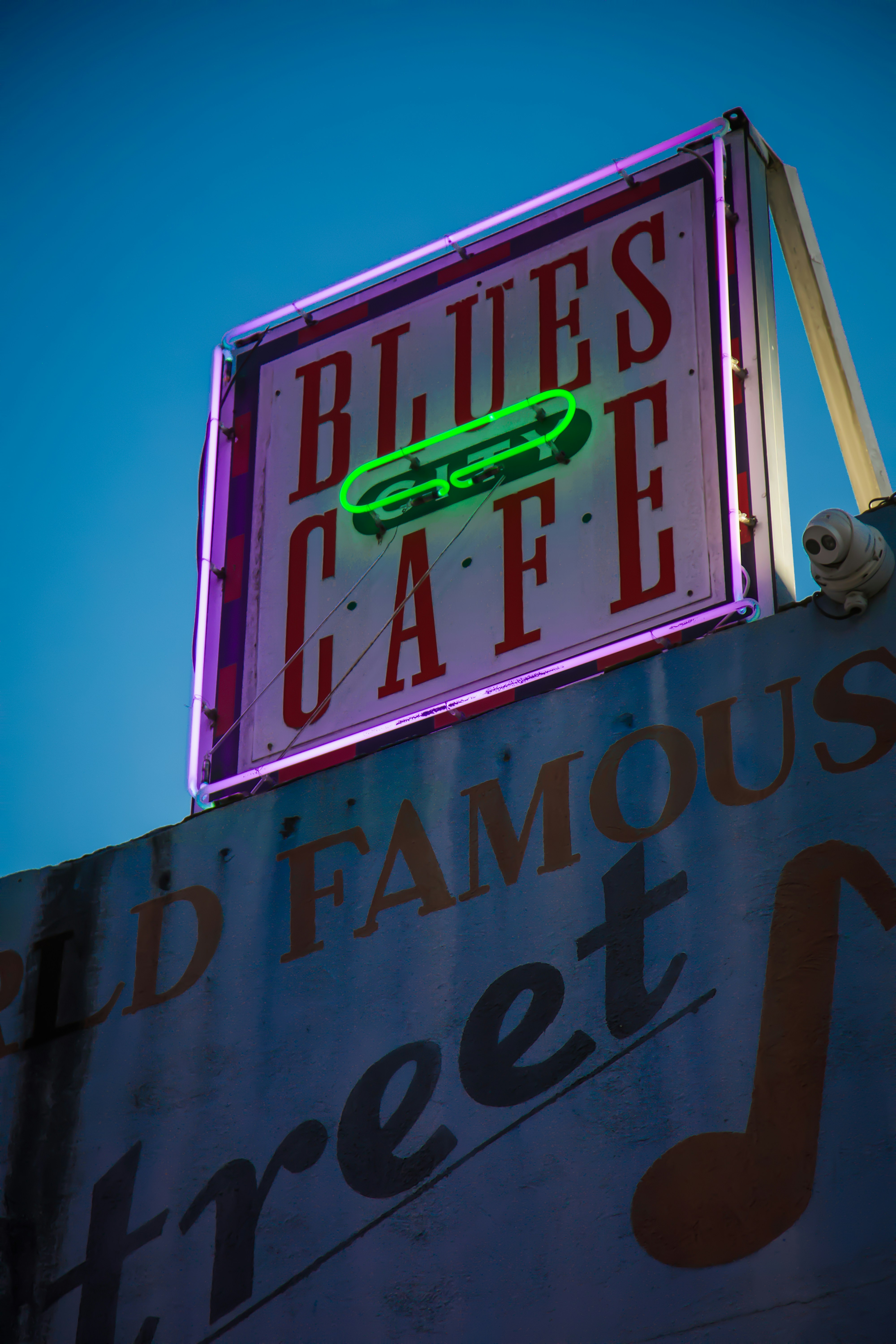 A neon sign on top of a building