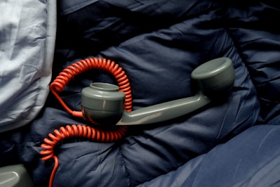 A sleeping bag with a phone hooked up to it