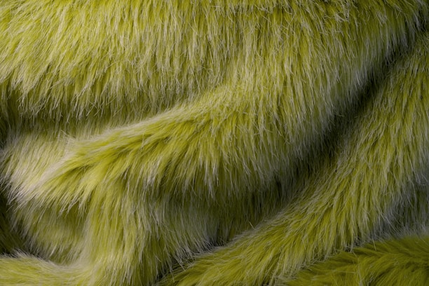 A close up of a green furry animal