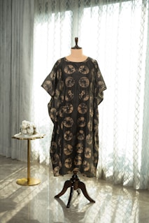 A dress on a mannequin in a room