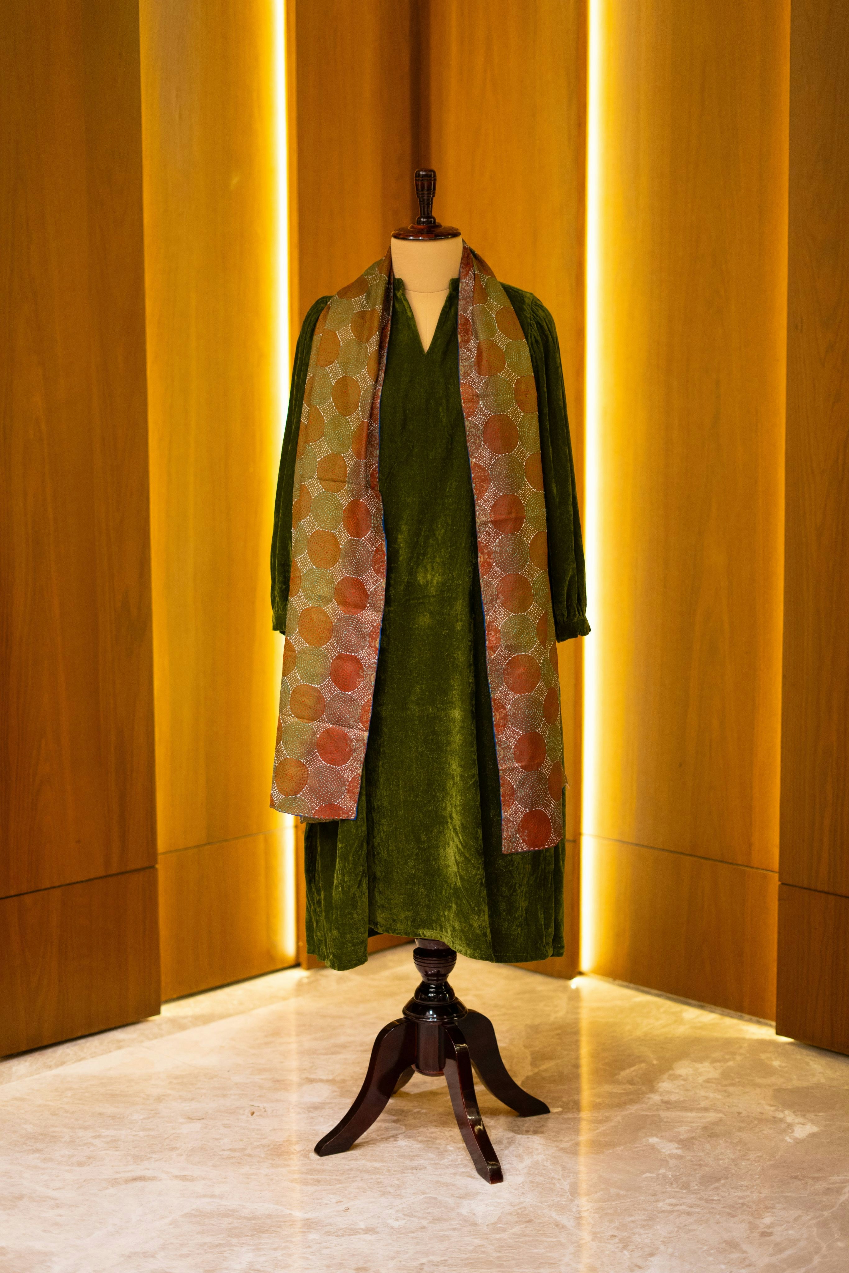 A dress on a mannequin in a room