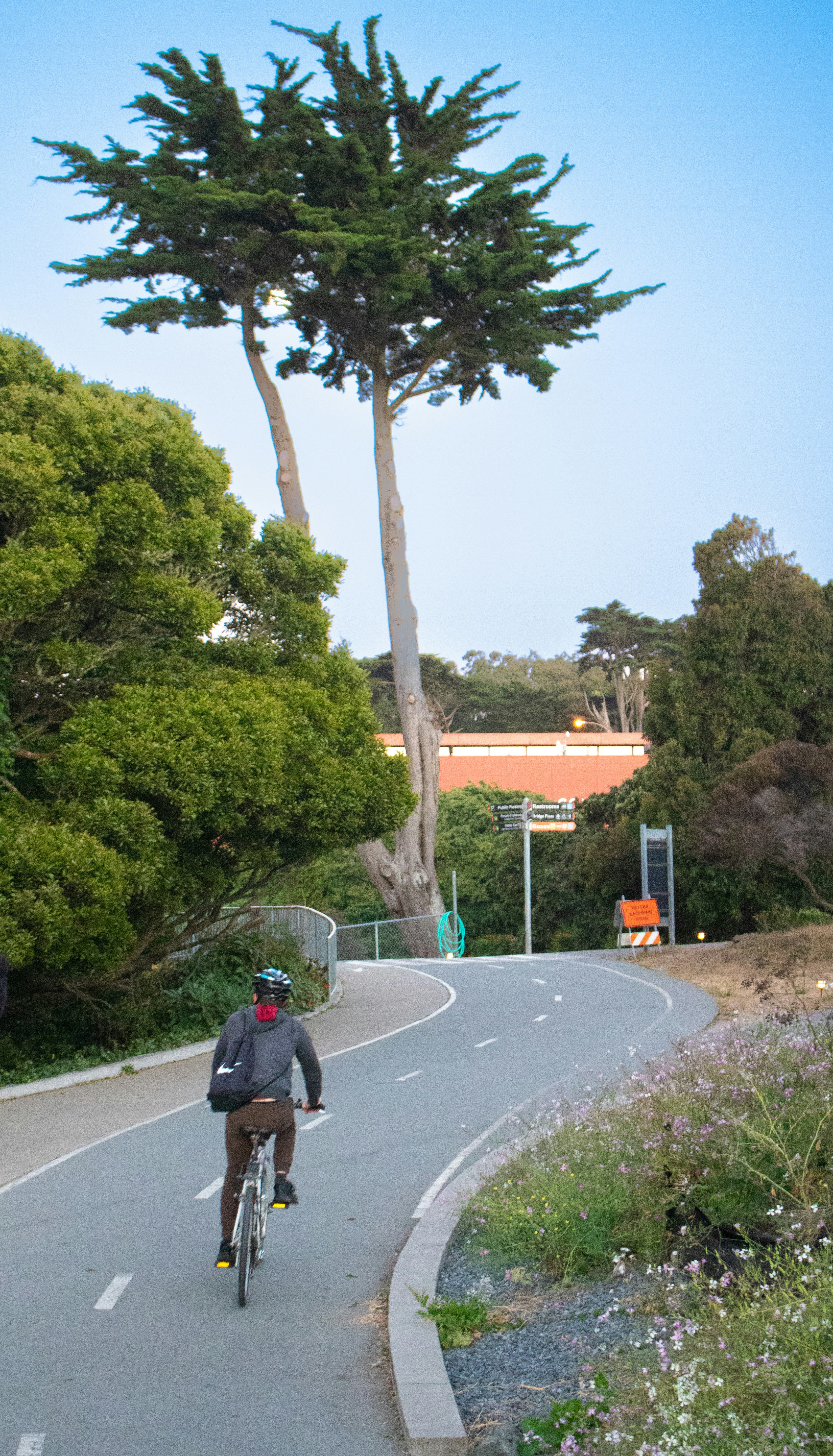 A man riding a bike down a curvy road