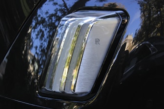 The rear view mirror of a black car