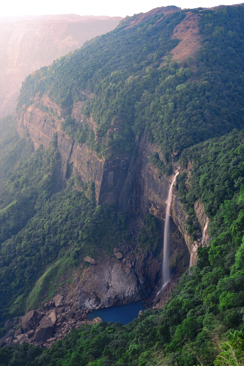 Waterfall surrounded by green hills in Cherrapunji, Meghalaya