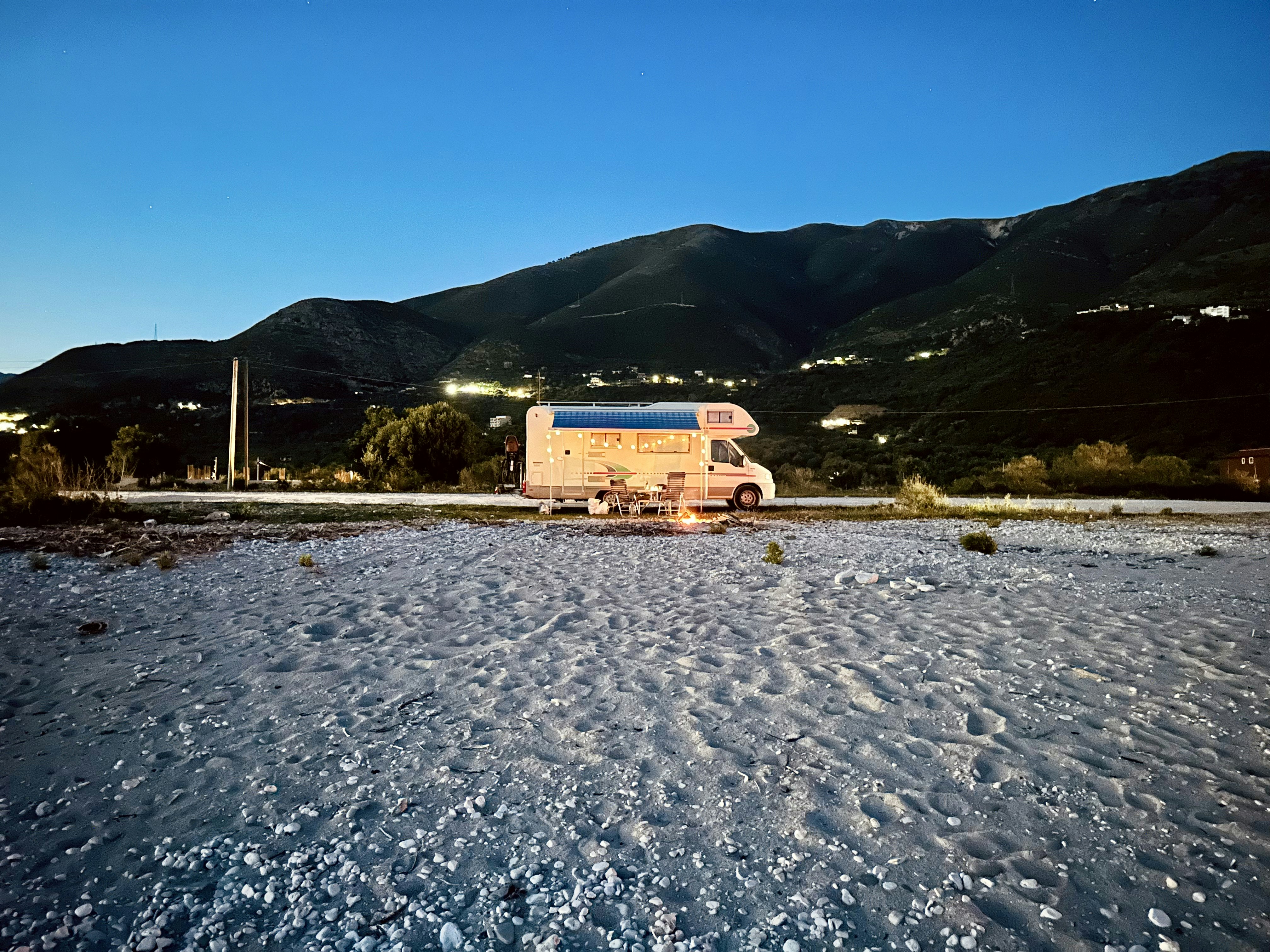 A van is parked in the middle of a snowy field