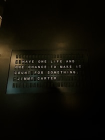 A sign on a wall that says i have one life and one chance to make
