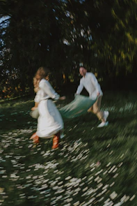 A couple of people that are in the grass