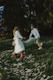 A couple of people that are in the grass