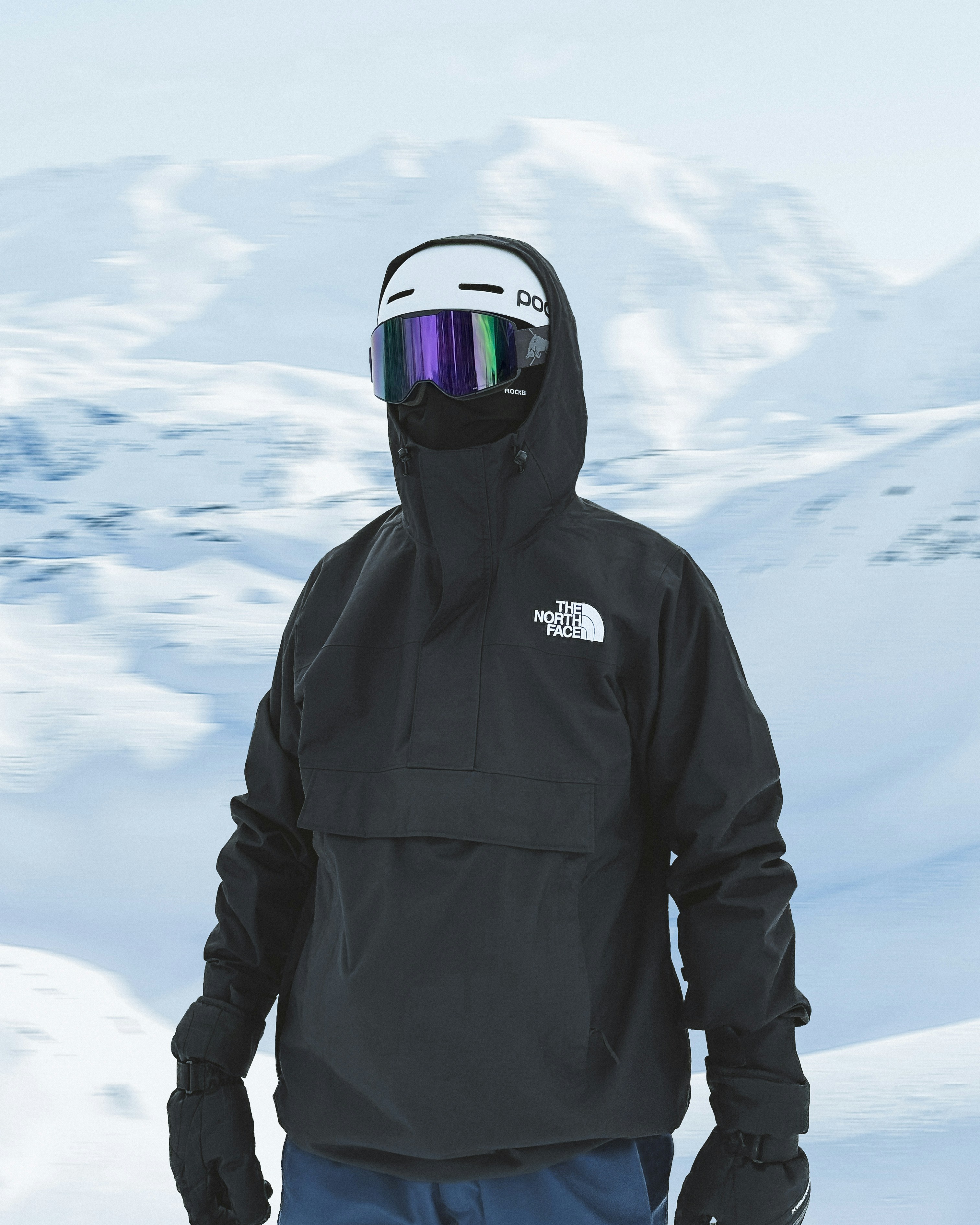 A man standing in the snow wearing a black jacket