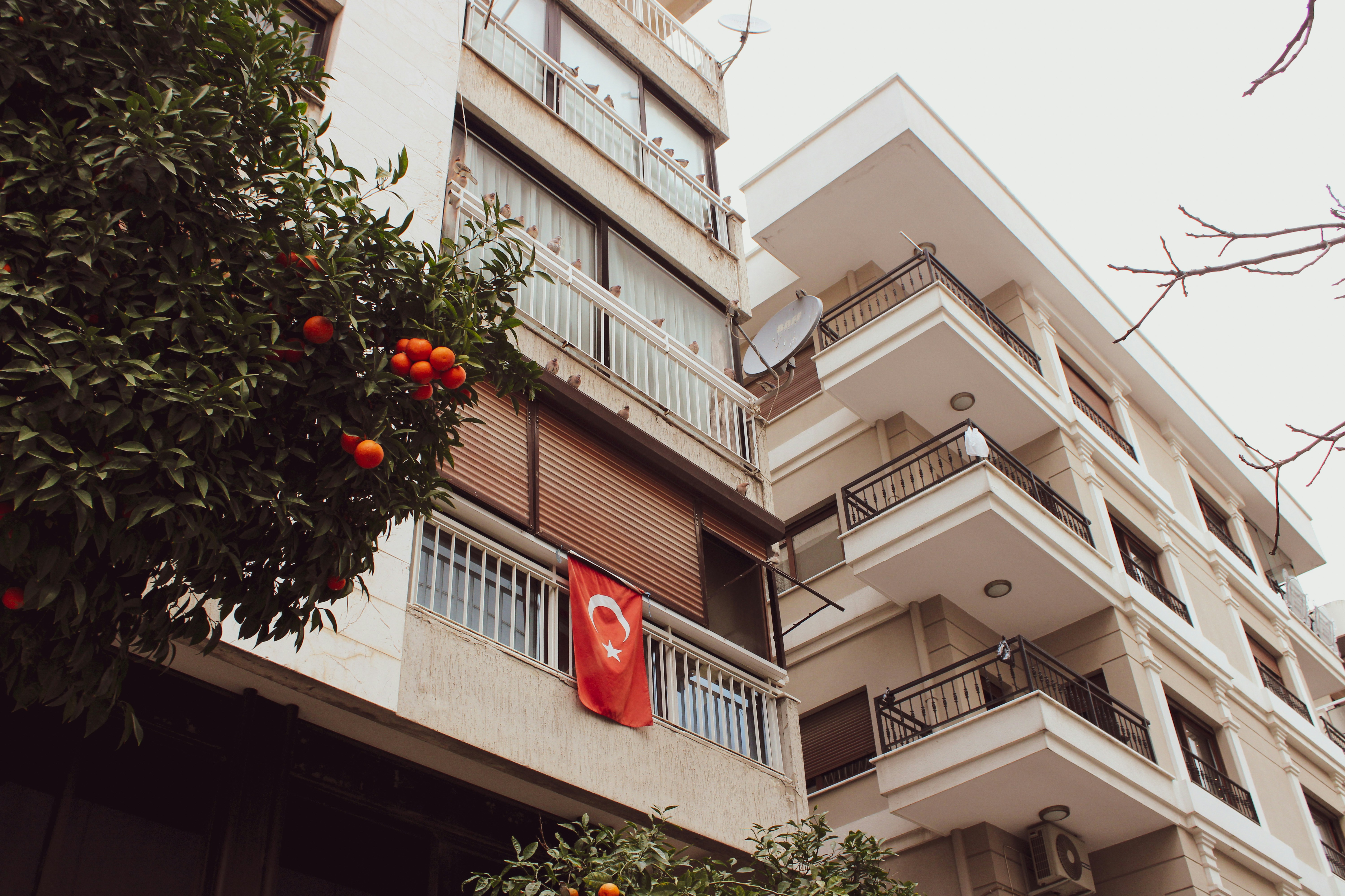 A tall building with balconies and balconies on the balconies
