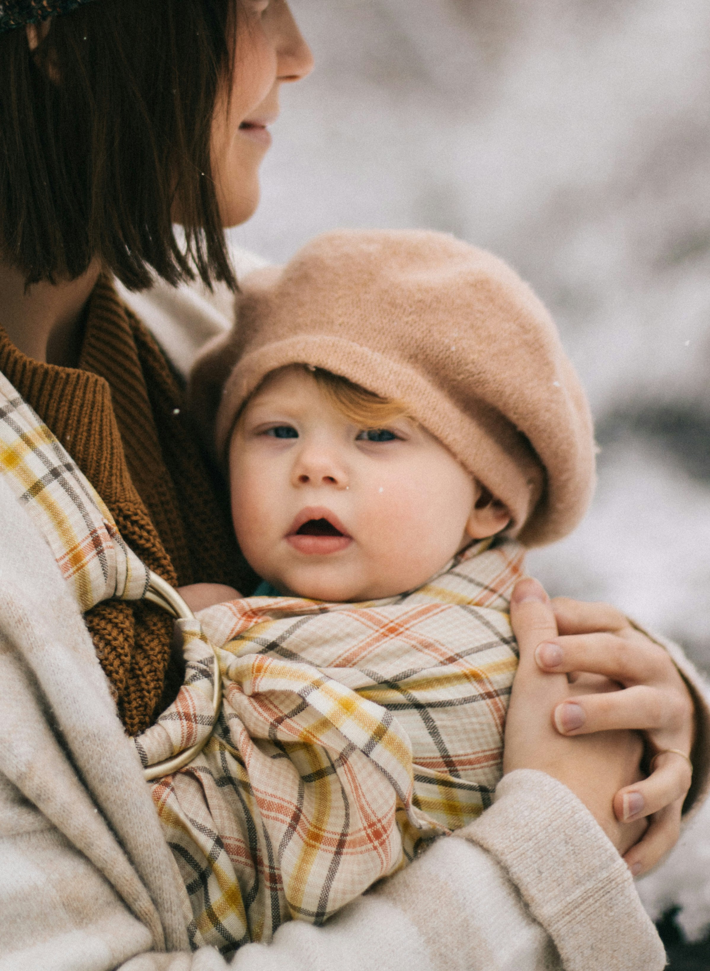 A woman holding a baby in her arms