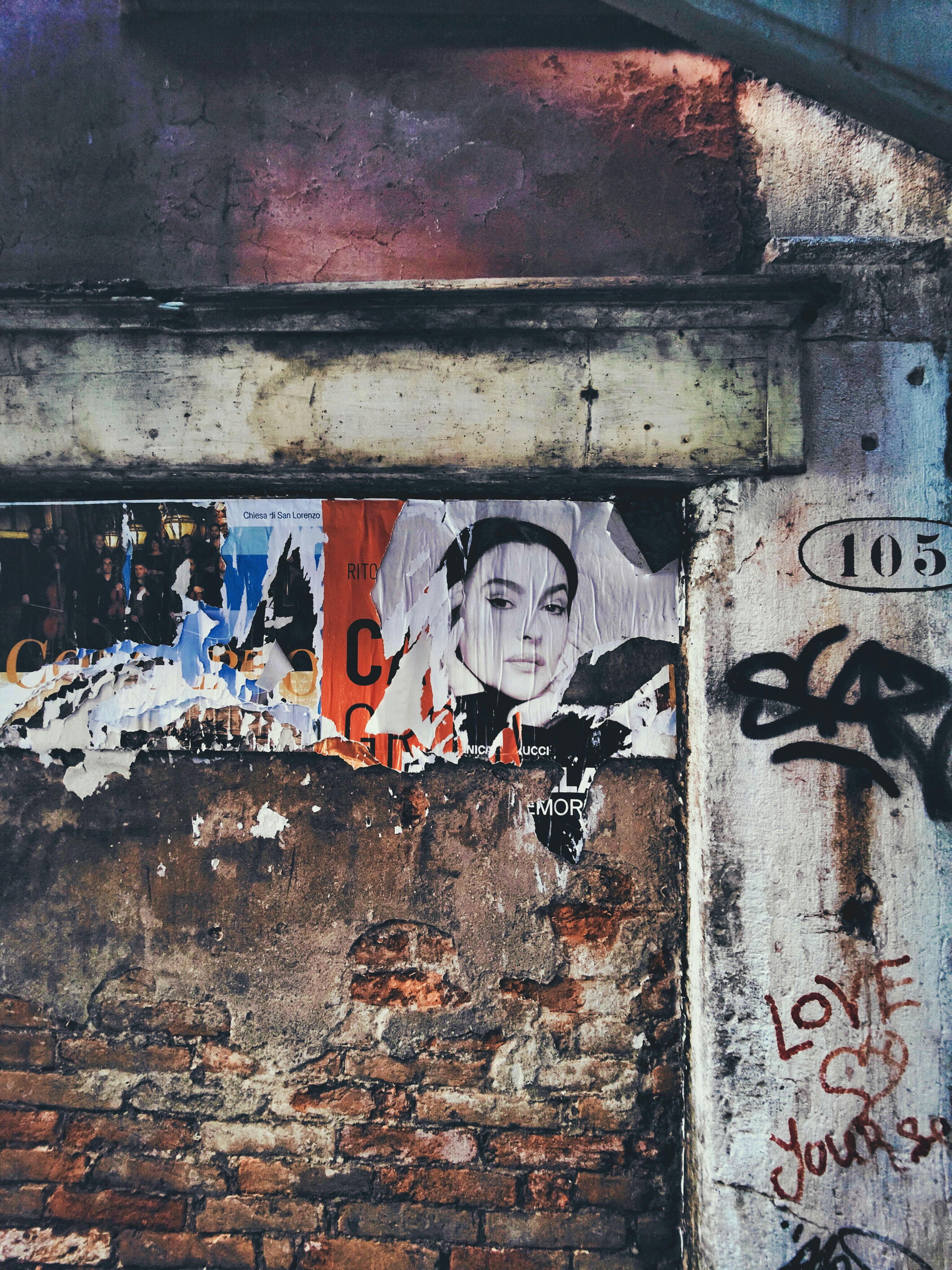 A wall with graffiti on it and a fire hydrant in front of it