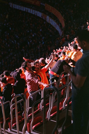 A crowd of people sitting in a stadium