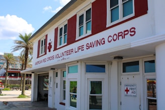 A red and white building with a red cross on it