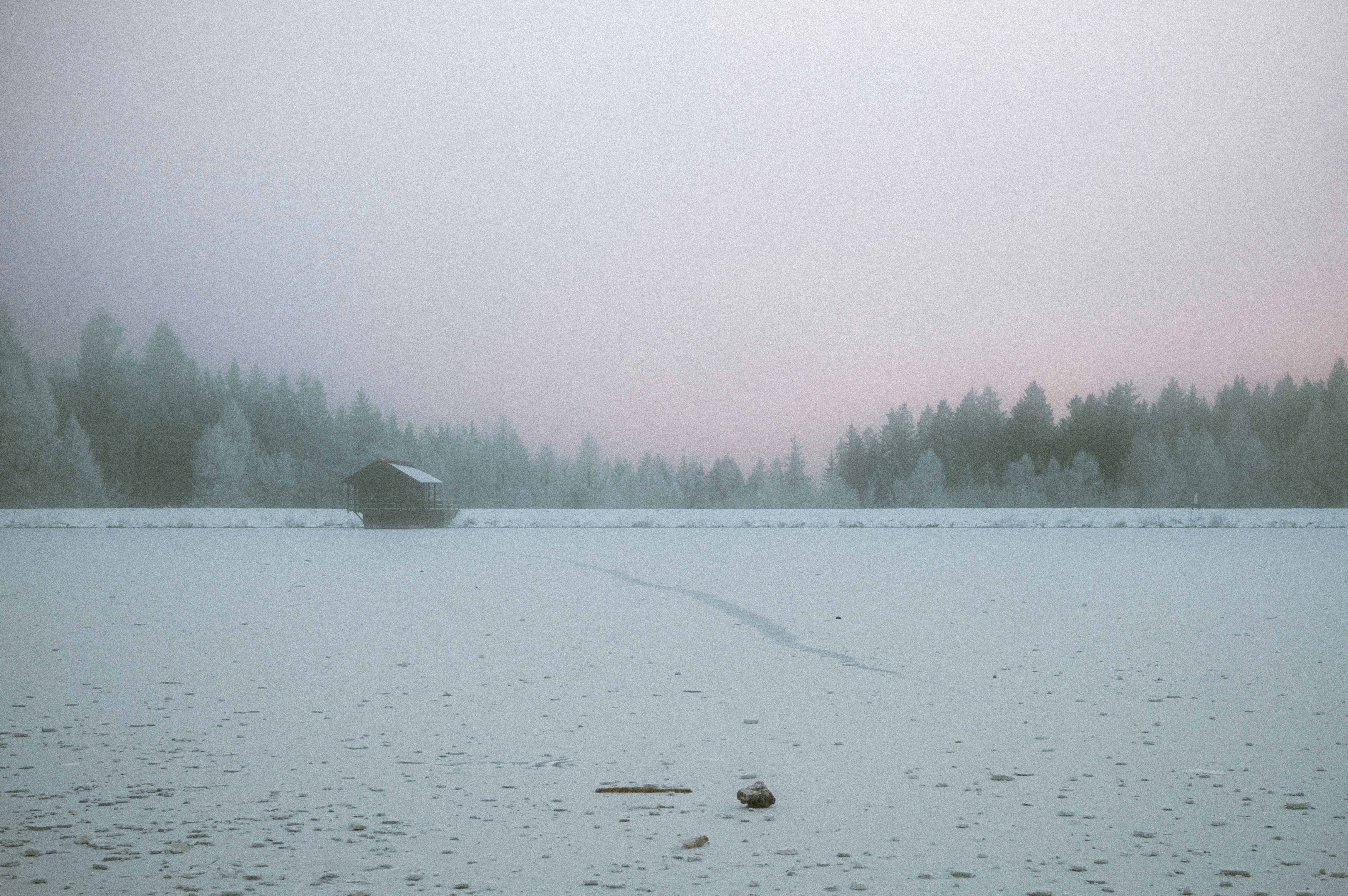 A blurry photo of a boat on a frozen lake