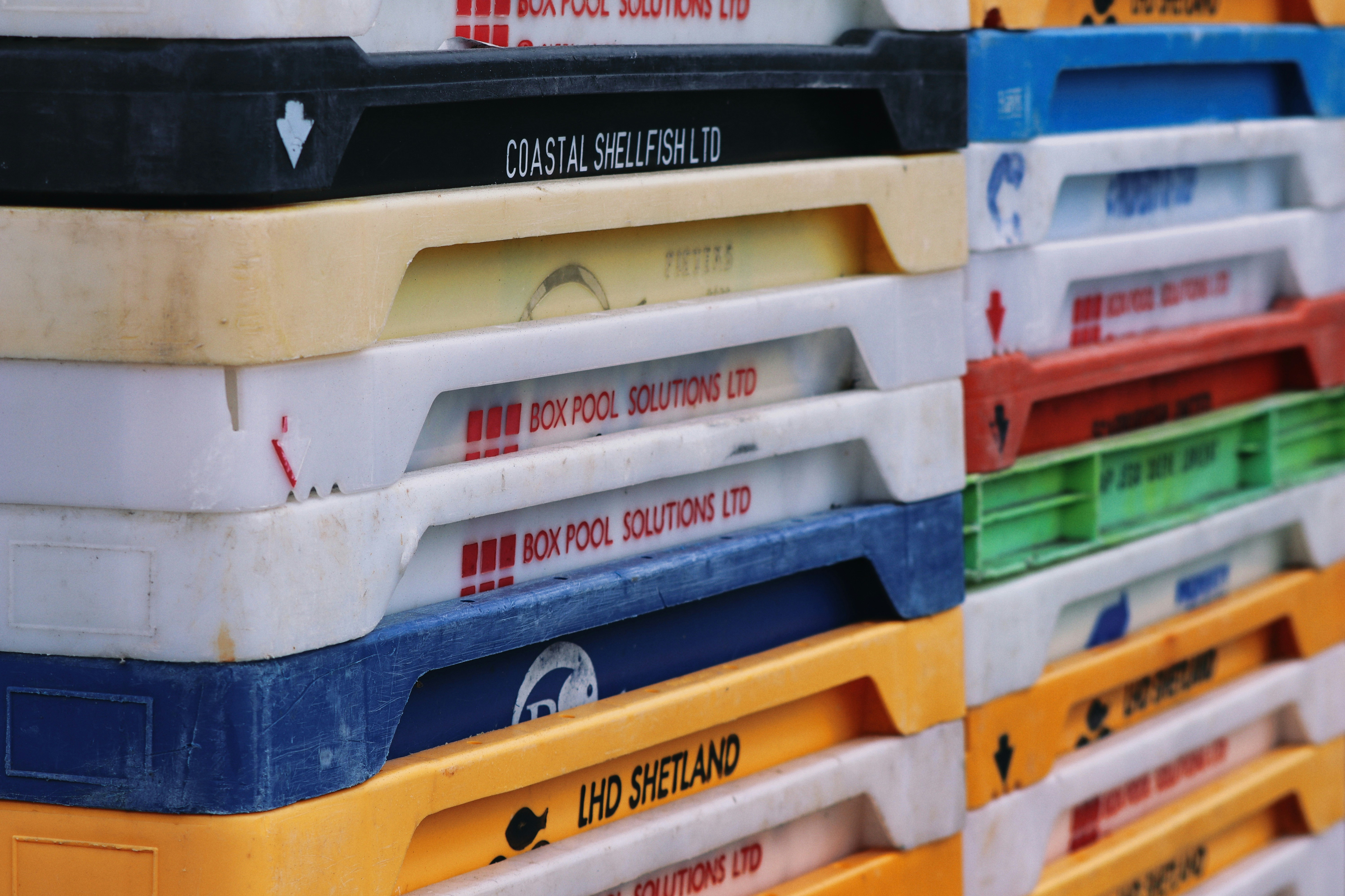 A stack of plastic containers sitting on top of each other