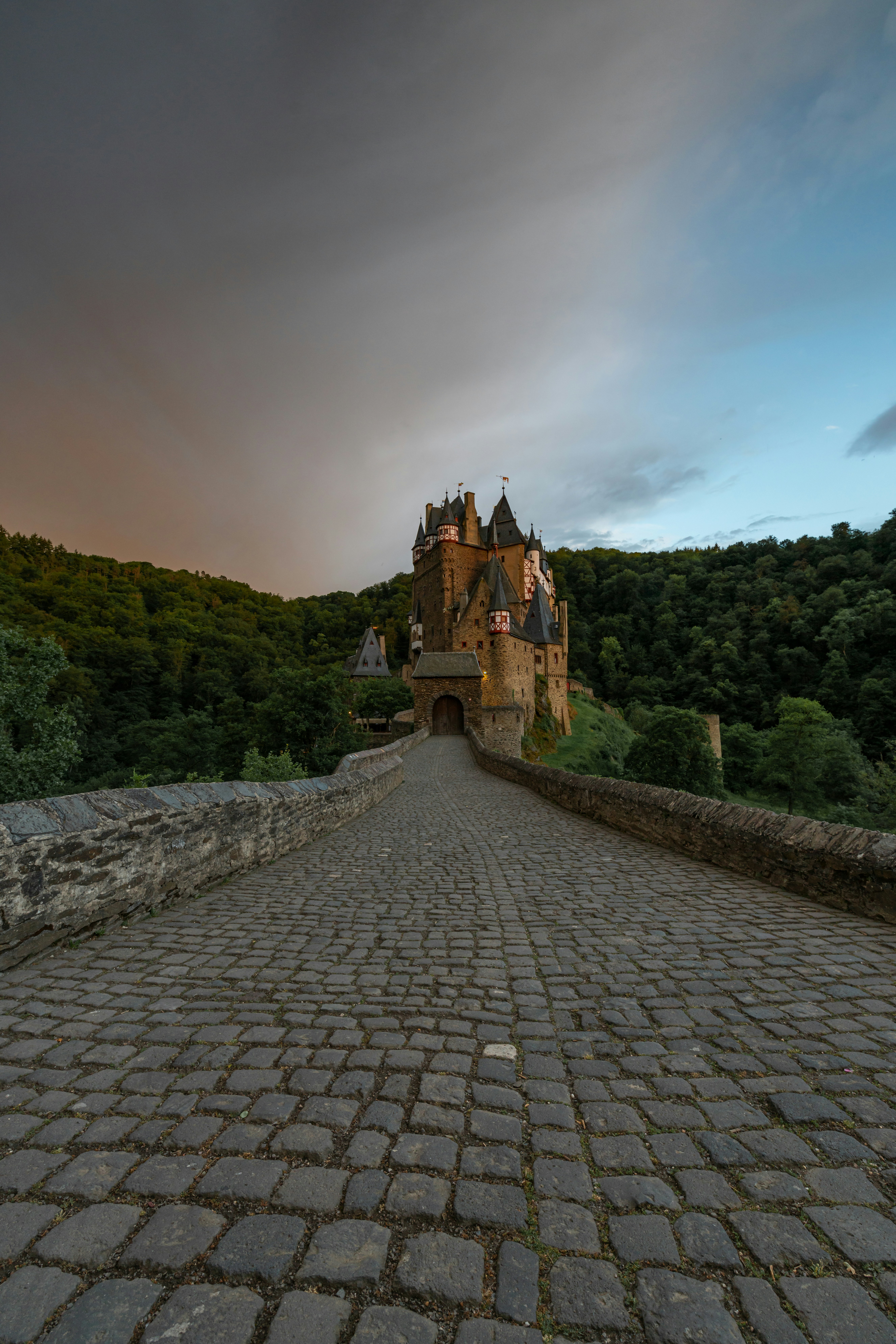 A large castle sitting on top of a stone road