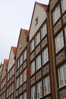 A row of brown and white buildings next to each other