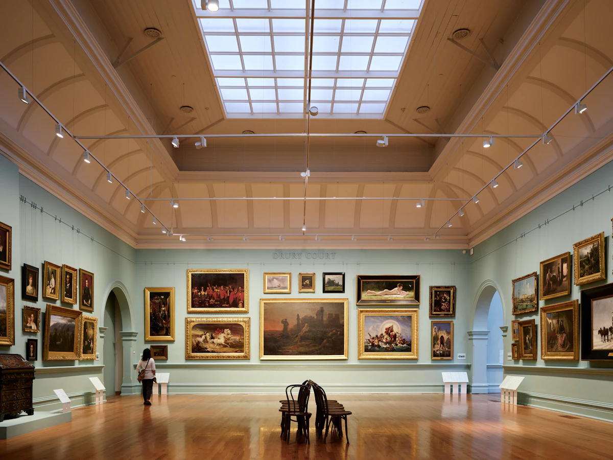 Salon hang under a skylight. Illustrative editorial image, not a photograph of Nichols House Museum.
