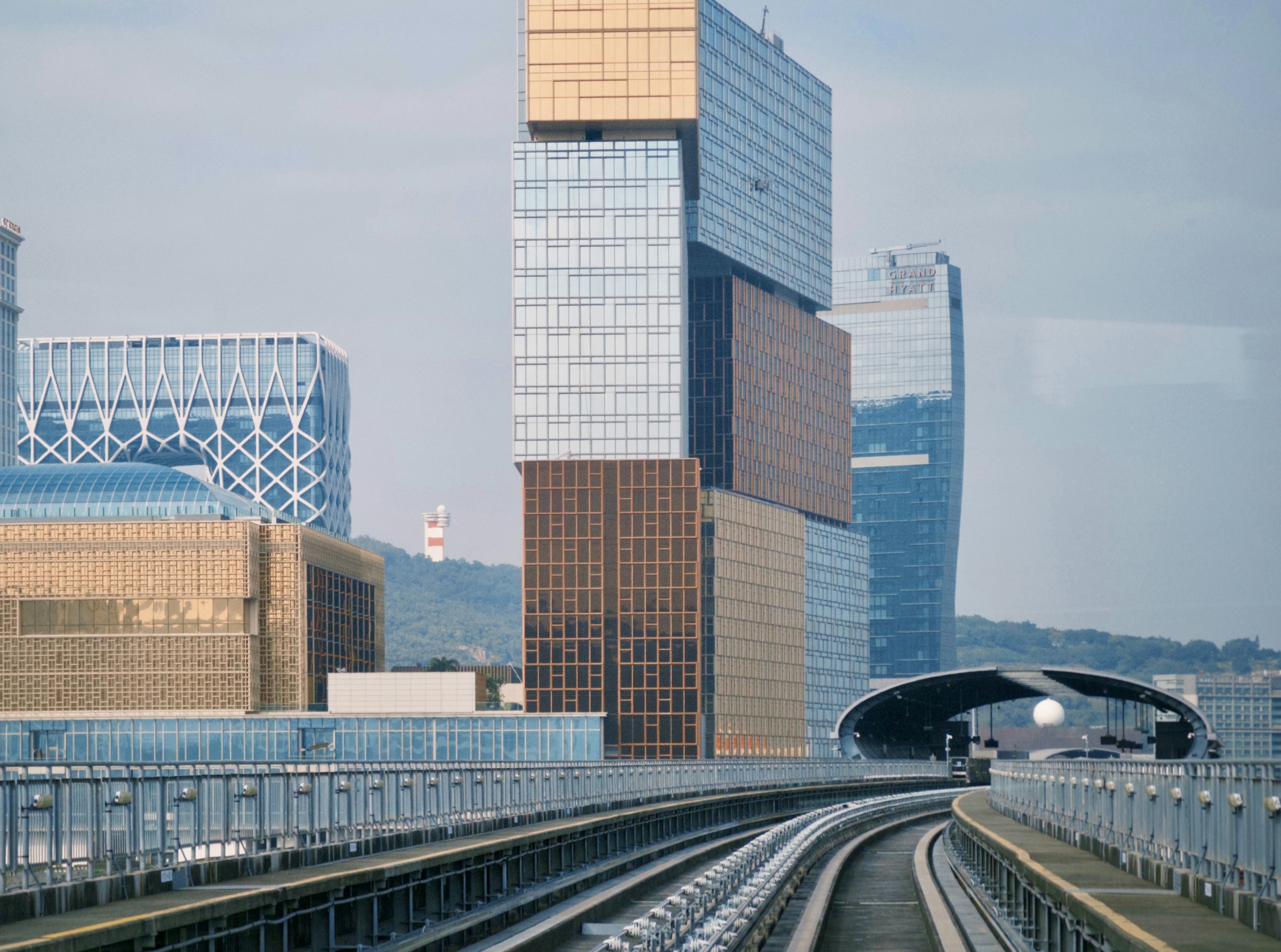 CTA 'L' train moving through the city with skyscrapers in the background - 1 bedroom apartments chicago