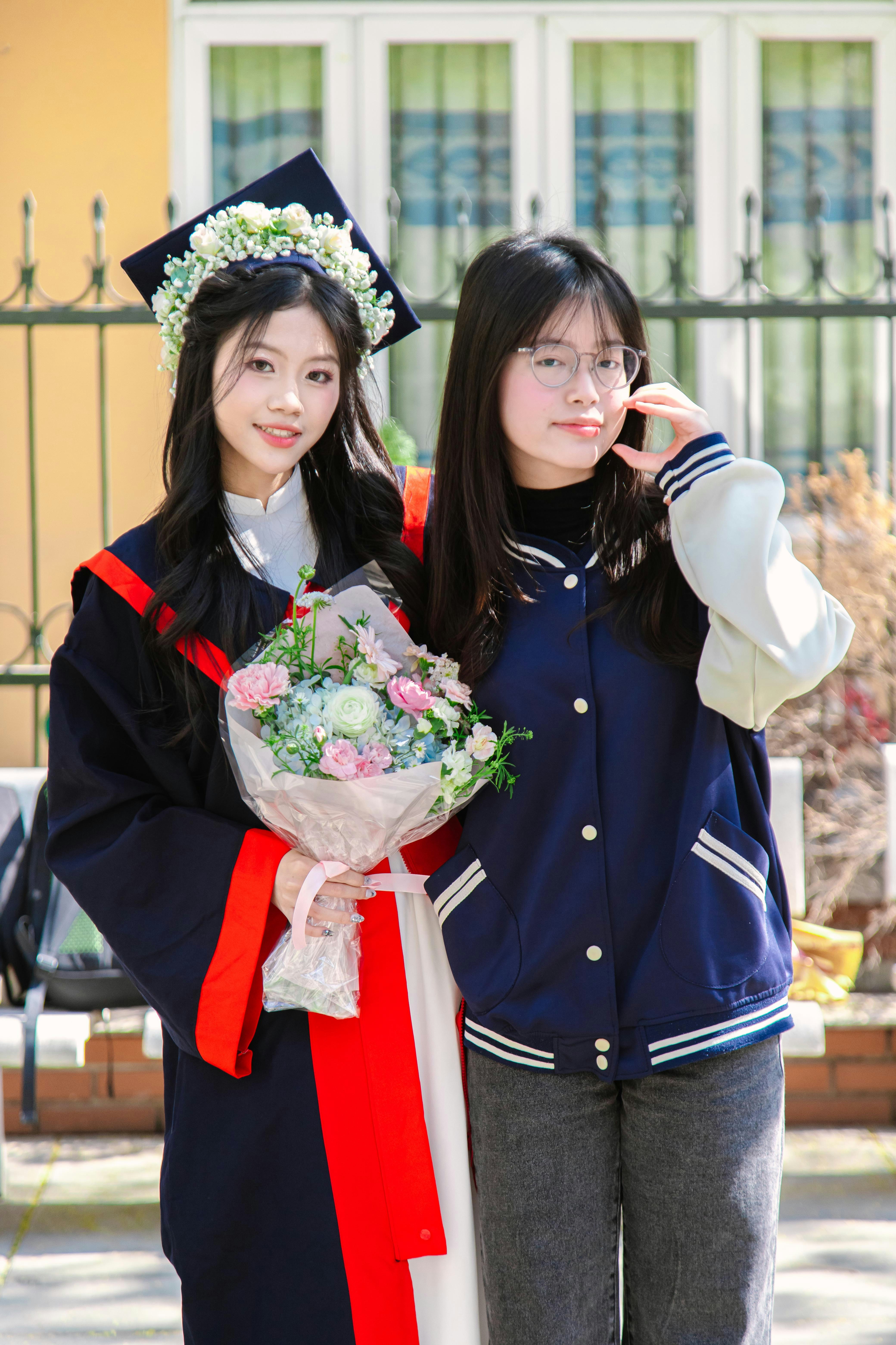 Two young women standing next to each other