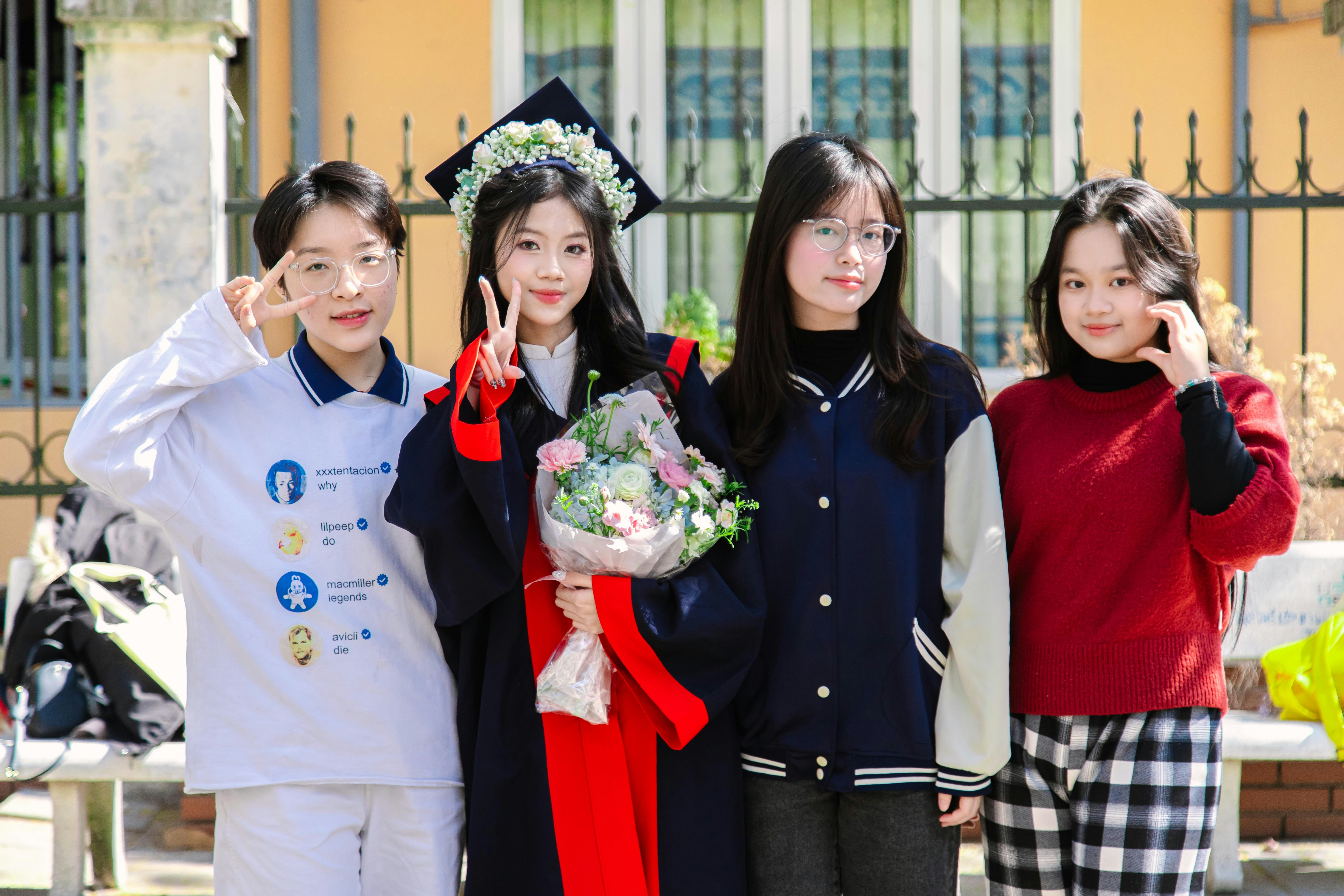 A group of young people standing next to each other