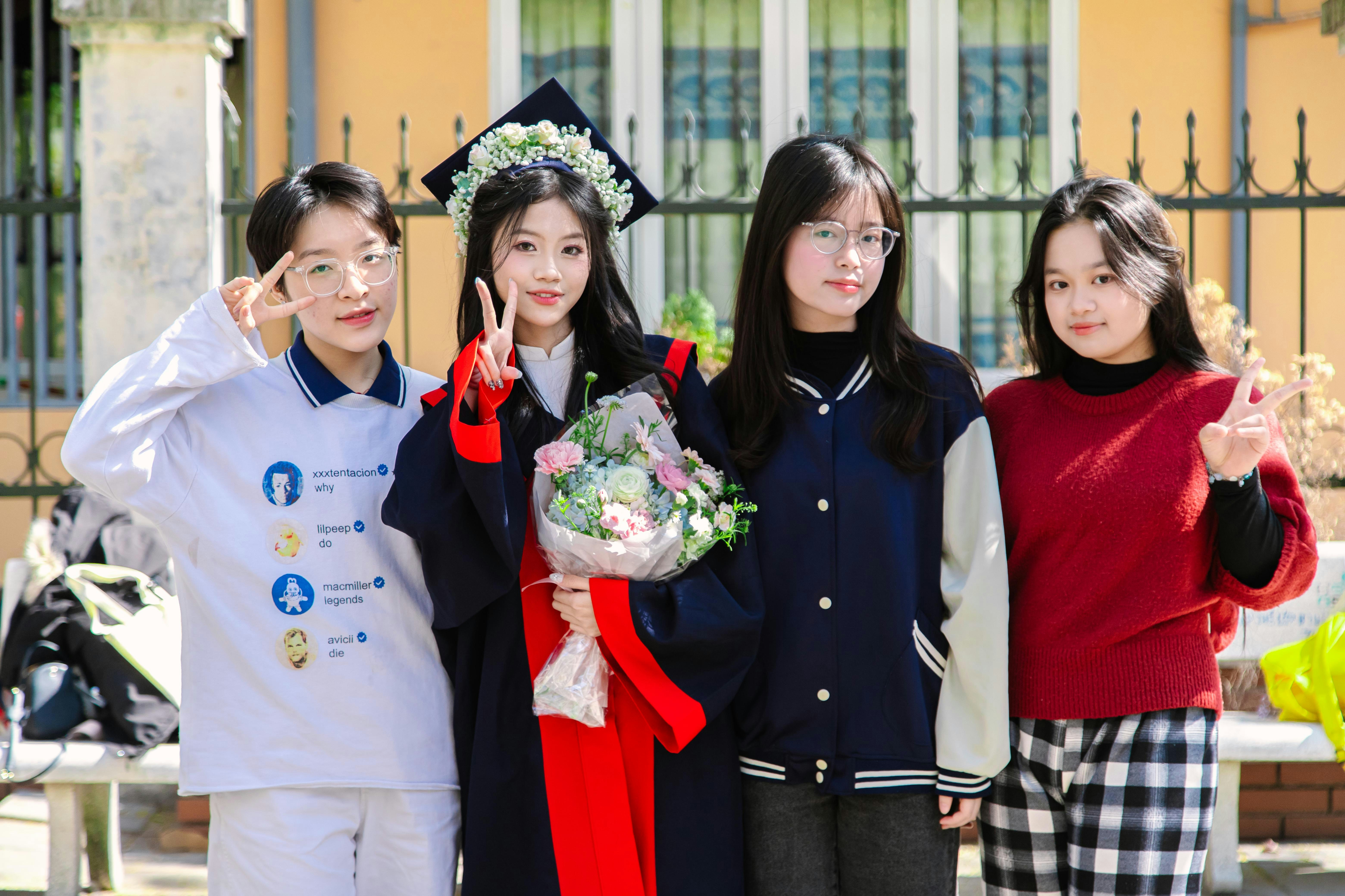 A group of young women standing next to each other