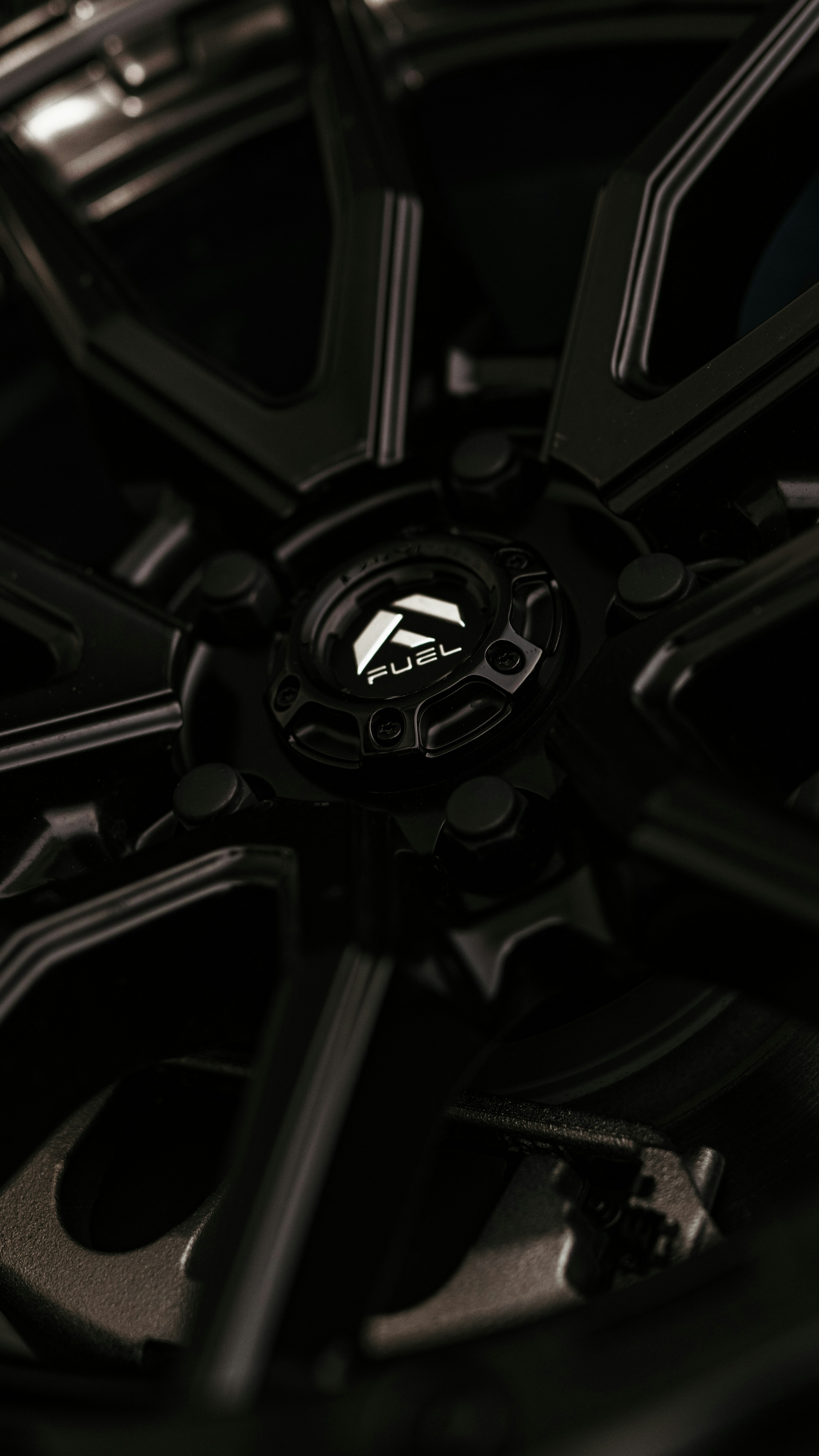 A close up of a black wheel on a car