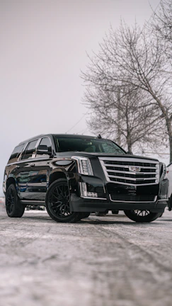 A black Cadillac Escalade 