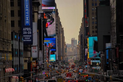 A city street filled with lots of tall buildings